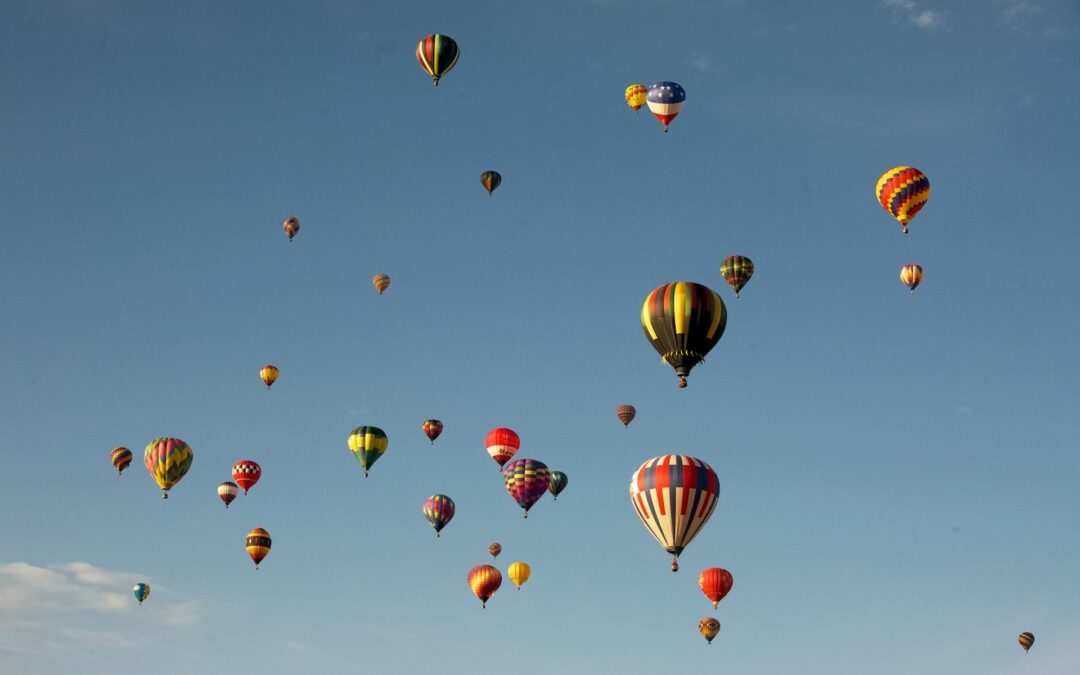 Colorful hot air balloons in a blue sky